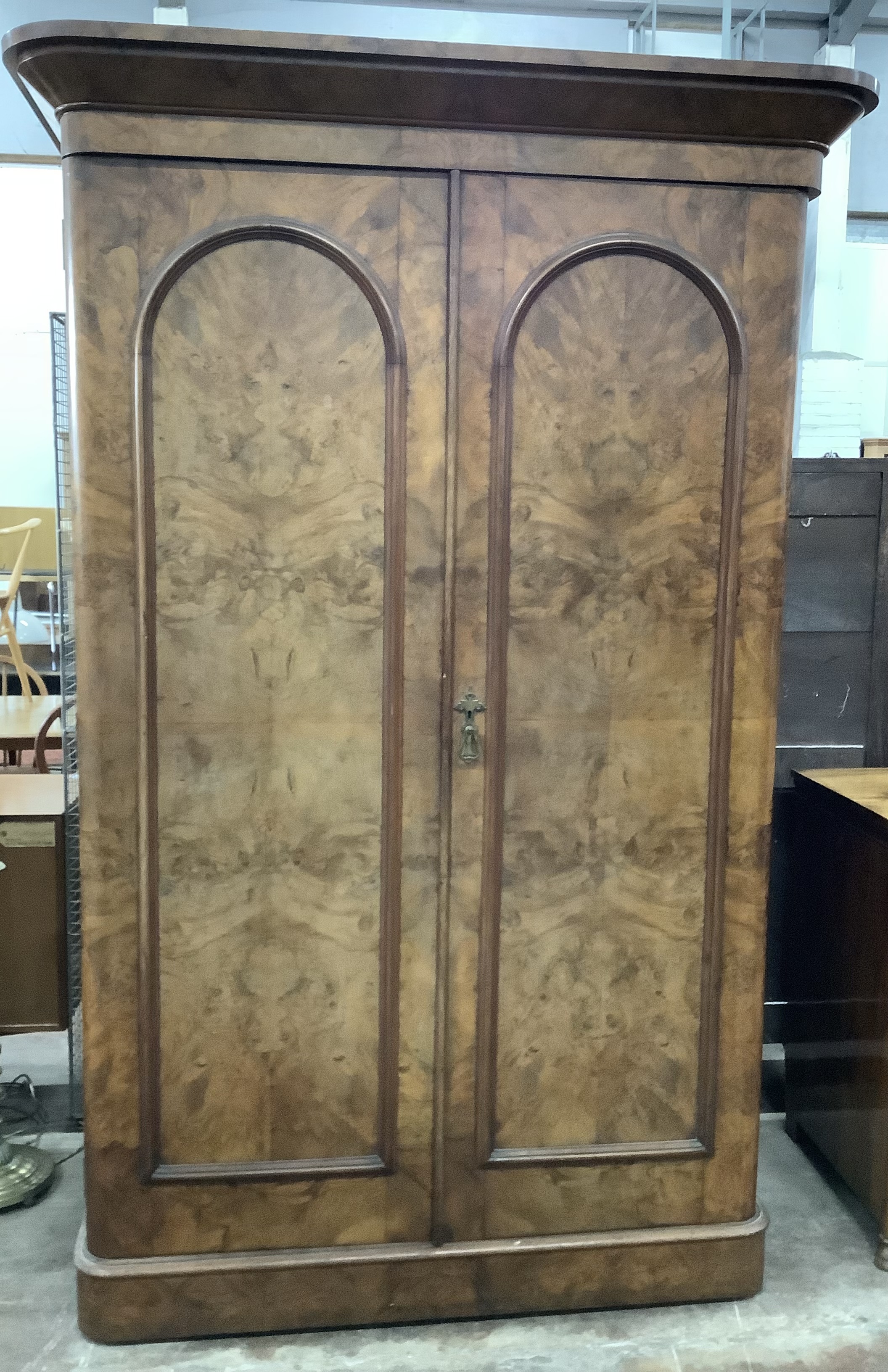 A Victorian walnut two door wardrobe, width 140cm, depth 70cm, height 214cm